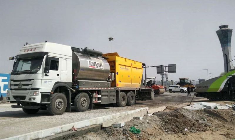 ag真人国际同步封层车助力西安机场、北京城郊路面建设